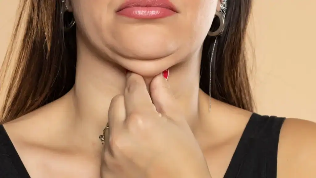 An image of a woman with double chin, sad, worried : Non Surgical Double Chin Removal Treatment in Sheffield, UK